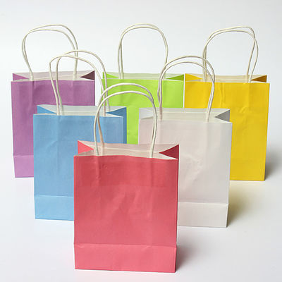 Las bolsas de papel recicladas que llevan fuertes con el aniversario Kraft de las manijas sacan bolsos